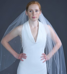  934-40 40” long (108”) cut edge veil with scattered 4mm pearls along the edge on a silver comb…(Ivory or white pearls)…All tulle colors 