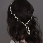 A-5616

9” headpiece of filigrees adorned with freshwater pearls, glass peals and flowers, all tipped with rhinestone & crystal accents on a rhinestone band…..*Silver or Matte Gold filigree….. (White or ivory pearls)……..