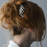 A 3” comb with a center flower & tips of tri rhinestones & pearl daisies….*Silver …………………