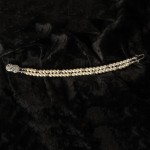 J-9445

Double strand bracelet of 5mm pearls with a silver pave’ clasp….. (Ivory or white pearls)