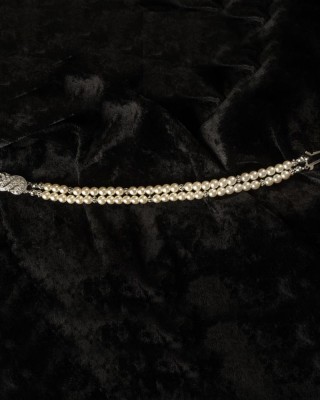 J-9445

Double strand bracelet of 5mm pearls with a silver pave’ clasp….. (Ivory or white pearls)